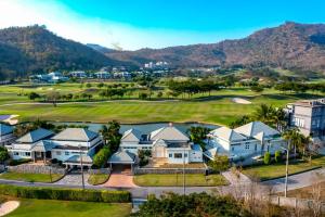 an aerial view of a golf course with houses at Nice 3BR with Golf Course View - BMG3 in Hua Hin
