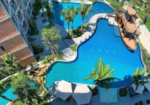 an overhead view of a pool at a resort at Pool Side Retreat 1 BED - TC-B105 in Nai Yang Beach