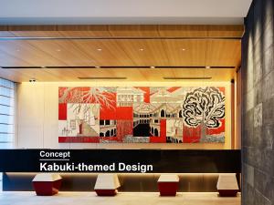 a lobby with a large painting on the wall at Mitsui Garden Hotel Ginza-gochome in Tokyo