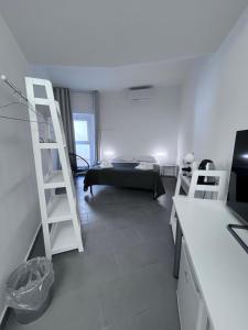 a room with a room with a bed and a ladder at Residenza Margot Cosenza in Cosenza