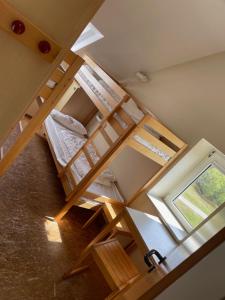 an overhead view of a bunk bed in a room at Jugendbildungsstätte Quellerdünen Jugendhaus OG in Spiekeroog