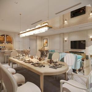 a large dining room with a table and chairs at Le Blanc Heritage Hotel in Kon Rung (1)