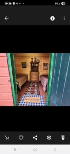 a screen shot of a room with a living room at Twin Bucks Cabin in Whiting