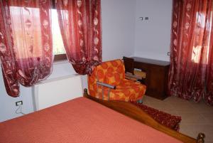 Postel nebo postele na pokoji v ubytování Agriturismo L' Agrumeto + 12 fotografií