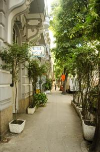 a street with trees and a hotel herbal sign on a building at Hotel Hostal (Adults Only) in Rio de Janeiro