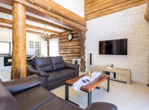 a living room with a couch and a table at Holiday Home Elizabeta in Slunj