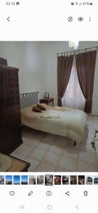 a bedroom with a bed and a dresser and a window at Marina's House in La Spezia