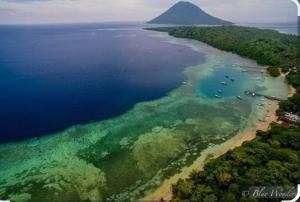 an aerial view of an island in the water at Bunaken Jhon Homestay in Manado