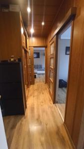 a room with a hallway with a door and a bedroom at Dwupokojowe mieszkanie w Benzina, apartamenty in Będzin