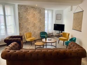 a living room with a couch and chairs at Le Grand Terroir in Dormans