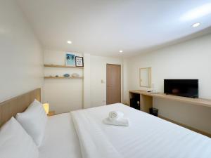 Postel nebo postele na pokoji v ubytování Fishtail Hostel Phuket
