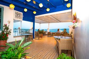 a restaurant with a view of the ocean at Palais Zahia Hotel & Spa in Tangier