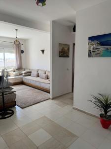 a living room with a couch and a table at Fès comfort stay in Fès