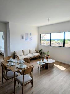 a living room with a couch and a table at Sea Beach Appartement in Tamarin