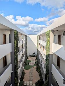 an internal view of an apartment building with a courtyard at Sea Beach Appartement in Tamarin