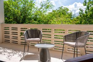 two chairs and a table on a patio at Cozy Couples Spot Explore and Relax in Cancún