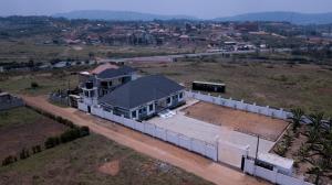 an aerial view of a house in a field at Gibson Motel in Mbarara