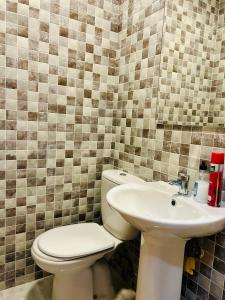 a bathroom with a toilet and a sink at ROOMS Malaga Centro Jinetes in Málaga +5 photos