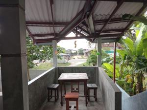 a table and chairs under awning on a patio at Villa sea 40 in Wenamulla