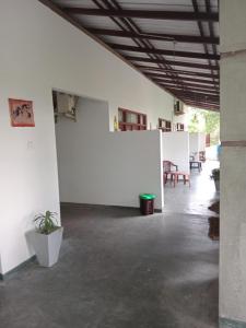an empty room with white walls and a table at Villa sea 40 Ambalangoda in Wenamulla +21 photos