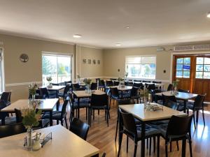a dining room filled with tables and chairs at EcoHotel El Almendro in Paine