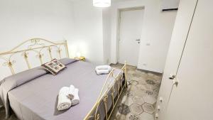 Кровать или кровати в номере Jasmine House il tuo rifugio centro di Ustica