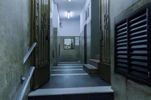 an empty hallway with stairs in a building at 360 Copa Galeria Ritz By SUHCasa in Rio de Janeiro