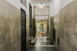a hallway with a food store in the background at 360 Copa Galeria Ritz By SUHCasa in Rio de Janeiro +1 photo