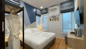 a bedroom with a bed and a tv in it at Queen Ma Pool villa in Ban Nong Bua +55 photos