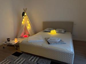 a bedroom with a bed with a christmas tree on the wall at Luxury Villa Residence Corbeanca in Corbeanca