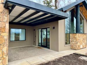 a house with awning on the side of it at Finca Torcivia Luna in Vista Flores