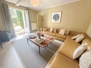 a living room with a couch and a coffee table at Beautiful Georgian Country House - Norfolk in Dilham