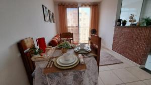 a dining room table with plates and dishes on it at Coop30 Belém in Belém