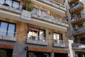 a building with balconies on the side of it at Hostal Alogar in Barcelona