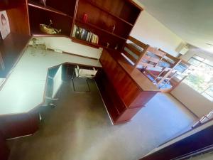 an overhead view of a kitchen and dining room at Bergamota Hostel in Curitiba +15 photos