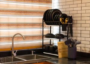 a kitchen counter with a sink next to a window at Pemium RiverSide Apartments Ile Ife Nigeria in Ile-Ife