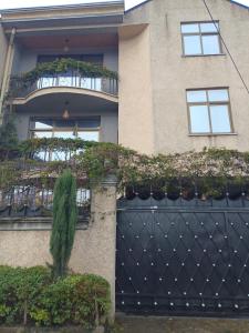 a house with a black gate with plants on it at Grace Guest House in Addis Ababa