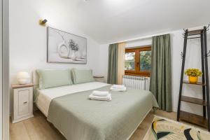 Ένα ή περισσότερα κρεβάτια σε δωμάτιο στο Apartman Afterglow +22 φωτογραφίες