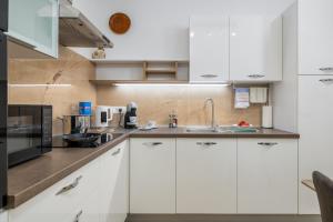Η κουζίνα ή μικρή κουζίνα στο Apartman Afterglow