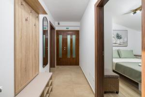 Ένα ή περισσότερα κρεβάτια σε δωμάτιο στο Apartman Afterglow