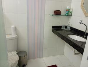 a bathroom with a sink and a toilet at Casa Cop30 Belém in Belém +5 photos