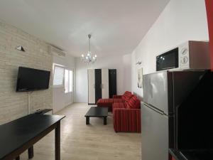 Televiisor ja/või meelelahutuskeskus majutusasutuses Merlyn