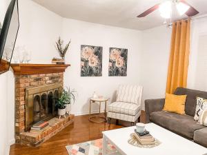 a living room with a couch and a fireplace at Tally Town Gem 2bdr 2 Ba townhome in Perkins