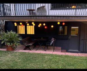 a patio with a table and chairs on a house at E11 Cologne in Cologne