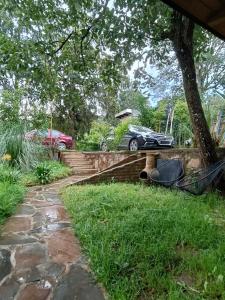 a car parked on the side of a house at Cabañas el tigre in Mazamitla +4 photos