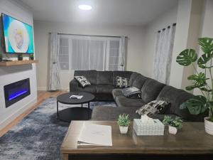 a living room with a couch and a table at The Perfect Spot in Corning