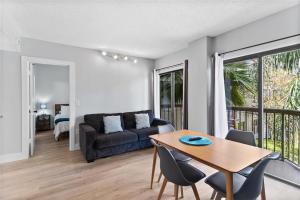 a living room with a table and a couch at JS Luxury Vacation in Orlando