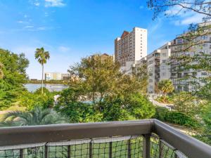 a balcony with a view of a river and buildings at JS Luxury Vacation in Orlando