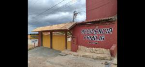 a building with a sign on the side of it at Condomínio em Canoa Quebrada in Aracati