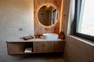 a bathroom with a sink and a mirror at Dzvin in Slavske +32 photos